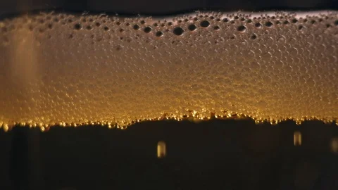 Yellow bubbles floating on a liquid. Stock-Footage 89310167