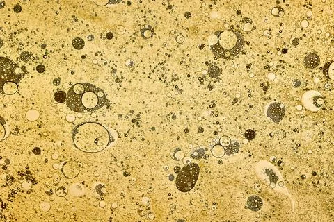 Yellow bubbles in a glass container close up Stock Photos