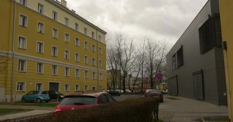 Yellow Building Camera Moves Toward Stadium Workers in Orange Workwear Road Stock Footage 58475314