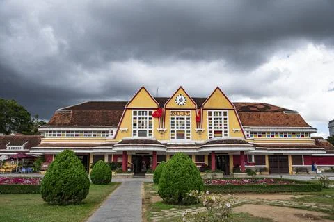 A yellow building with a clock on the front Stock Photos