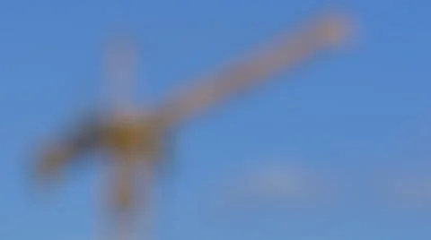 Yellow building crane in 4k Stock Footage 67907120