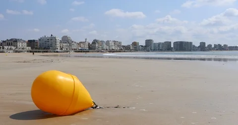 Yellow buoy on the beach Stock Footage 109444591