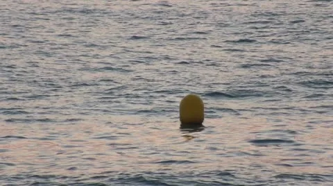 Yellow Buoy bobs on the waves, closeup Stock Footage 12088751