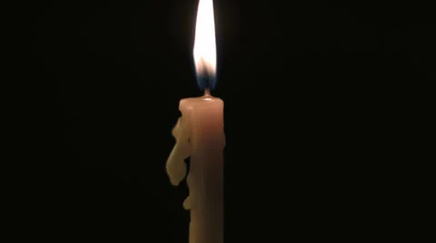 Yellow burning candle timelapse Stock Footage 34599495
