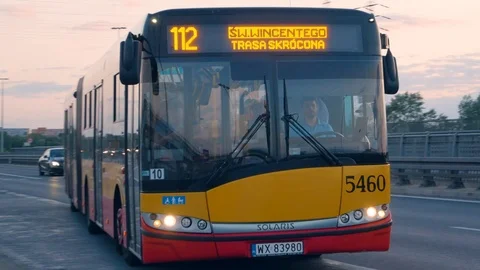 Yellow Bus Arrival At Station - Evening  with a beautiful sky - Warsaw Stock Footage 111757766