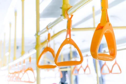Yellow bus handle on ceiling for standing passenger, public transportation tr Photos