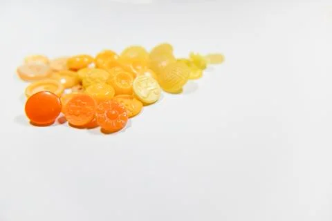 Yellow buttons of different shape and size on the white background. Selective Stock Photos