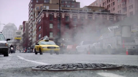 Yellow Cab passing by in downtown Seattle, steam coming from manhole Stock Footage 36788816