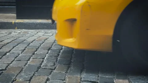 Yellow cab on stone pavement in SOHO, New York Stock Footage 62241269