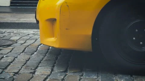 Yellow cab on stone pavement in SOHO, New York Stock Footage 62241297