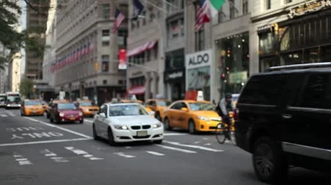 Yellow cab traffic 5th Avenue New York City urban street cars Stock Footage