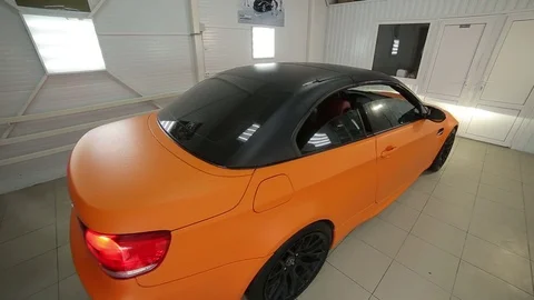 Yellow cabrio car folding roof:Back view Stock Footage 76357568