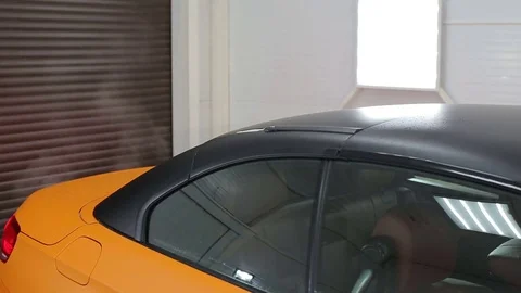 Yellow cabrio car folding roof.Close-up Stock Footage 76357776