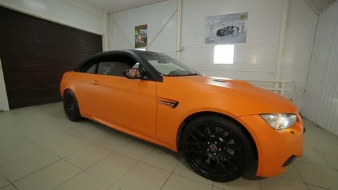 Yellow cabrio car folding roof:Front view Stock Footage 76357404