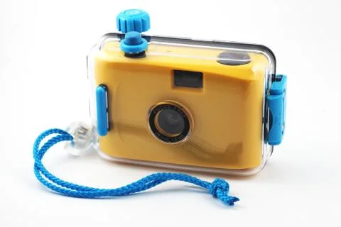 Yellow camera in waterproof box Stock Photos