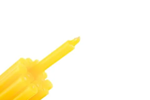 Yellow candle bundle on bottom left isolated Stock Photos