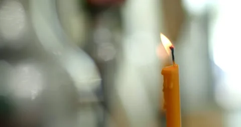 Yellow candle flame lights.close up view footage of igniting a candle. Stock Footage 240943801