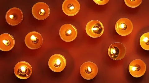 Yellow candles on an orange background, top view, romantic pattern. Stock Footage 197062329