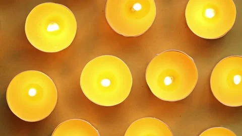 Yellow candles on an orange background, top view, romantic pattern. Stock Footage 211435731