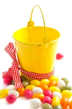 Yellow candy bucket Stock Photos