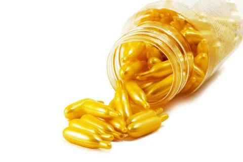Yellow Capsule and Bottle Stock Photos