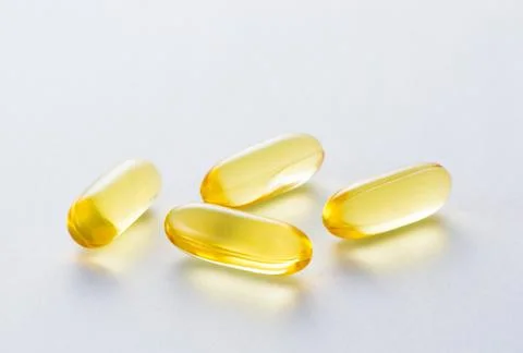 Yellow capsule Stock Photos