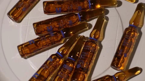 Yellow capsules rotating C0028 Видео 254907227