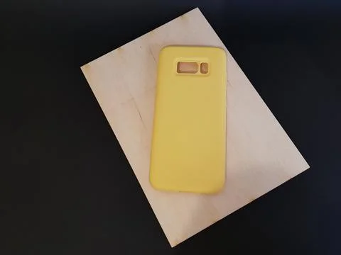 Yellow case on a black isolated background Stock Photos