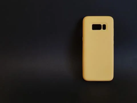 Yellow case on a black isolated background with mockup Stock Photos