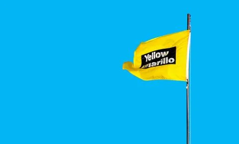 Yellow caution beach flag Stock Photos
