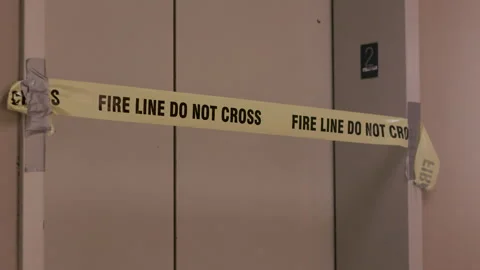 Yellow caution tape across elevator door 库存影片 263673539