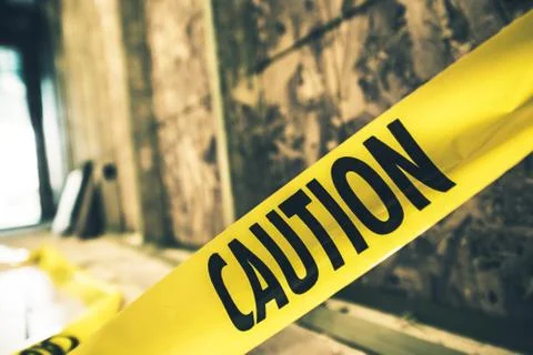 Yellow caution tape closeup. constriction zone safety. 库存照片