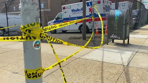Yellow caution tape closing off sidewalk Video stock 137073557