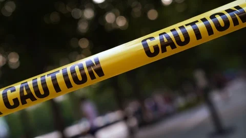 Yellow caution tape fluttering in the win Stock Footage 116743689