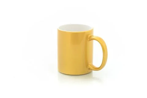 Yellow ceramic mug on white background for coffee or tea Stock Photos