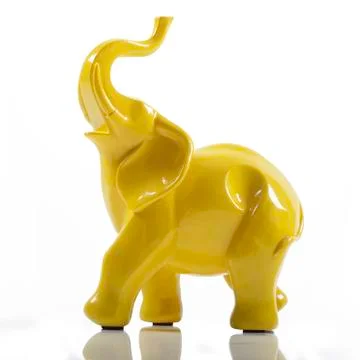 Yellow Ceramic Porcelain Elephant on White with Reflection Stock Photos