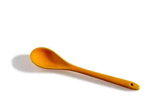 Yellow ceramic tea spoon Stock Photos