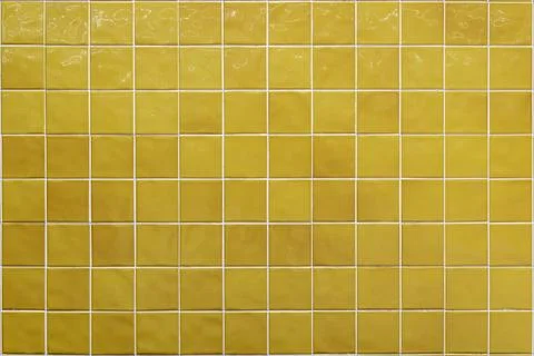 Yellow ceramic tile background. Old vintage ceramic tiles in green to decorate Stock Photos