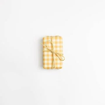 Yellow check pattern gift box isolated on white background. top view, copy... Stock Photos
