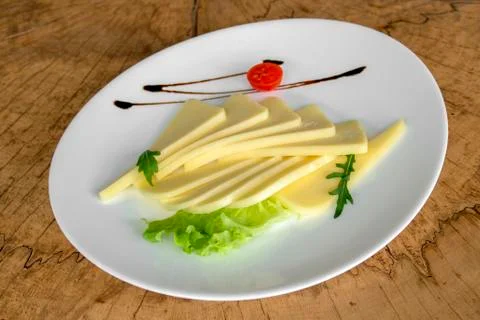 Yellow cheese typical of the Balkans. Stock Photos