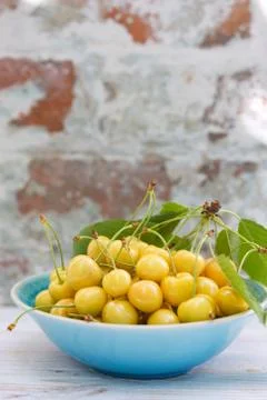 Yellow cherry in a bowl Stock Photos