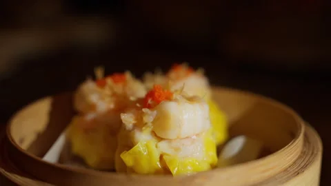 Yellow Chinese dim sum adorned with succulent ebi shrimp on top. These Video stock 250007401