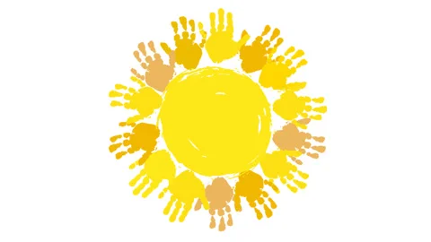 A yellow circle with the prints of children's palms is spinning. Handprinted sun Stock Footage 120556730