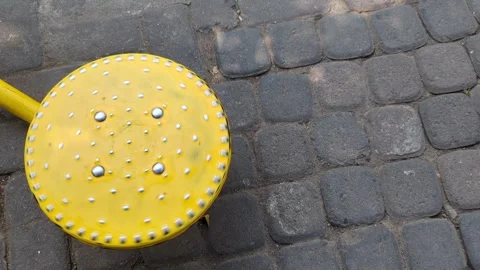 A yellow circular object with small silver studs is sitting Video stock 322557598