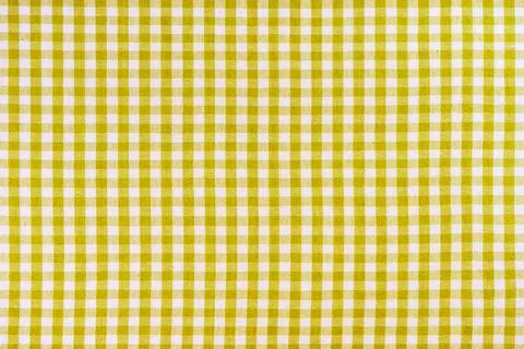 Yellow classic checkered tablecloth texture, background with copy space. Stock Photos