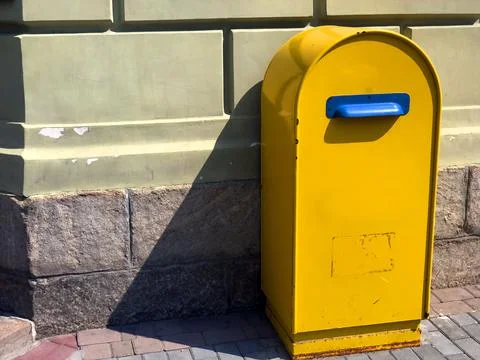 Yellow classical postbox in Dnipro, Ukraine. A large old floor-standing mailbox 스톡 사진