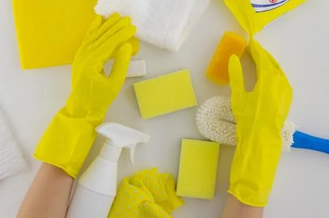 Yellow cleaning set for different surfaces in kitchen, bathroom and other rooms Stock Photos