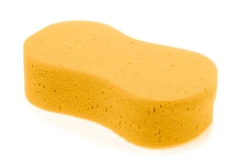 Yellow cleaning sponge with rounded edges on white background Stock Photos