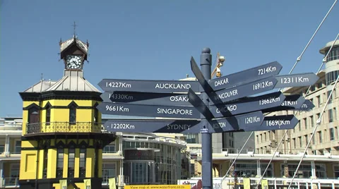 Yellow clock tower and distance signs, Cape Town Stock Footage 37761913