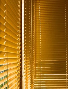 Yellow closed shutters Stock Photos